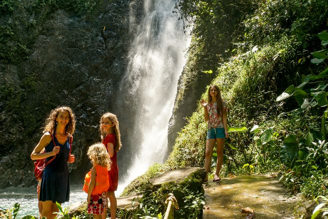 Standing in front of the waterfall.